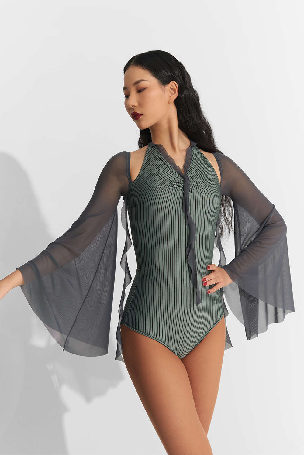 Introducing the DANCE QUEEN 767 Lantern sleeve Leotard, in a stunning dark cyan color. Designed for ultimate freedom and grace, this leotard features elegant lantern sleeves that will make you feel like a true dance queen. Elevate your performance with this luxurious and exclusive piece.