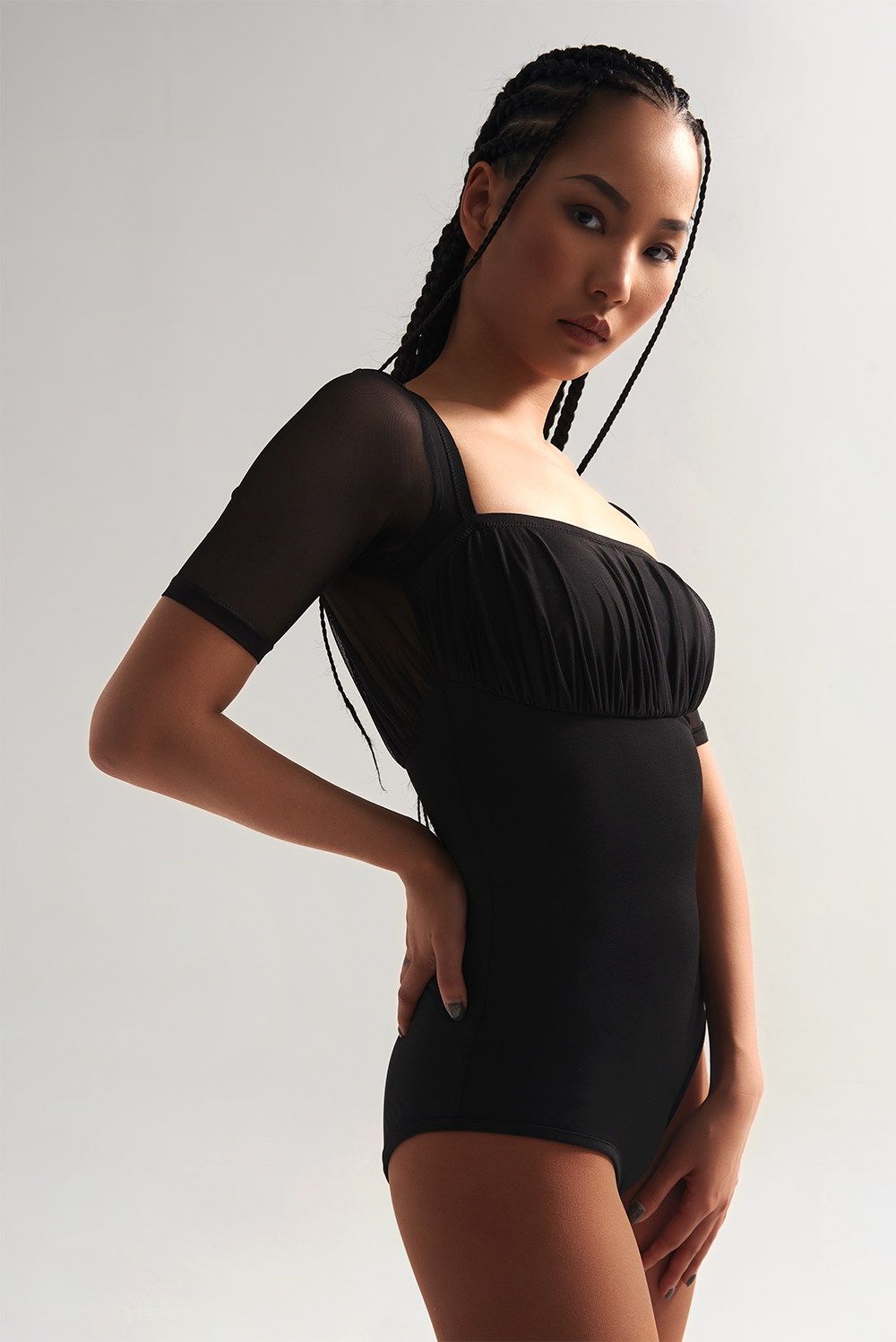 The DANCE QUEEN 713 Square Neck Short Sleeve Black Leotard is a professional and sleek option for dancers. With a square neck and short sleeves, this leotard provides a comfortable and stylish fit.