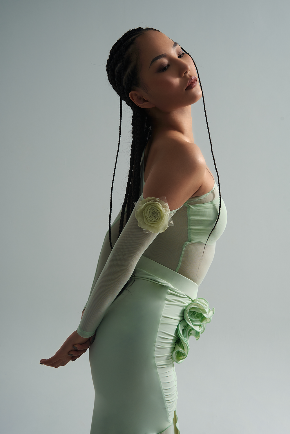 Experience the passion of dance with the DANCE QUEEN 656-3 Mint Mambo Leotard. The off shoulder design and delicate flower details add a touch of elegance, while the long sleeves provide coverage and movement. Feel confident and stylish while performing your best in this ballroom leotard.