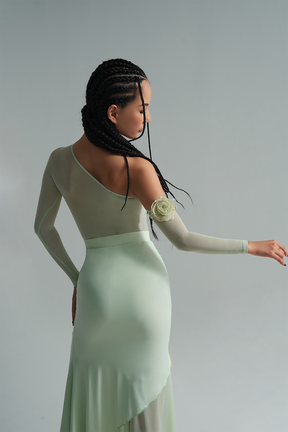 Experience the passion of dance with the DANCE QUEEN 656-3 Mint Mambo Leotard. The off shoulder design and delicate flower details add a touch of elegance, while the long sleeves provide coverage and movement. Feel confident and stylish while performing your best in this ballroom leotard.