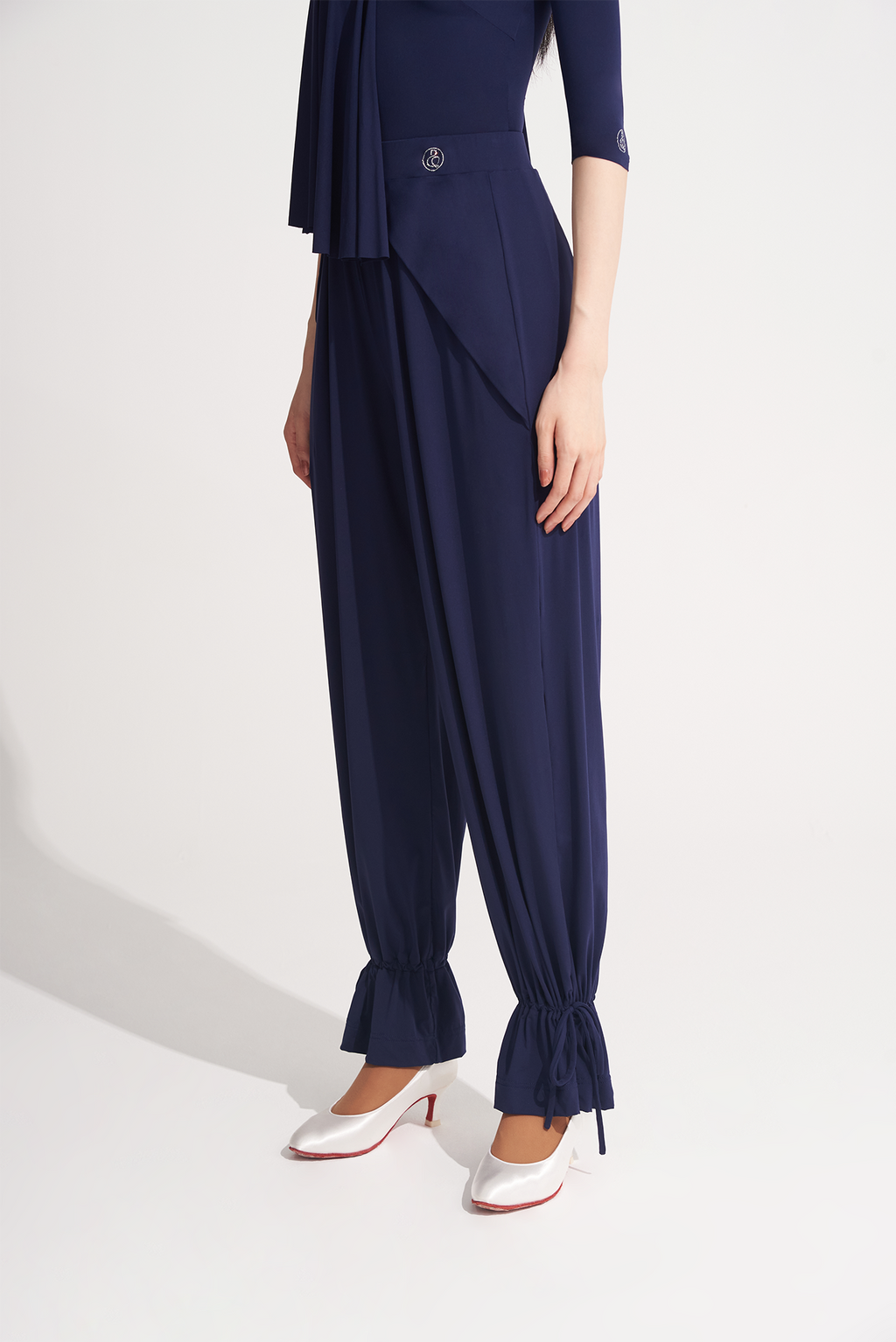  Elevate your dance experience with DANCE QUEEN 701-10 Navy Blue Trouser. Designed for ballroom training, these trousers feature an ankle strap for added support and elegance. Made with high-quality materials, they offer both comfort and style for your dance moves.