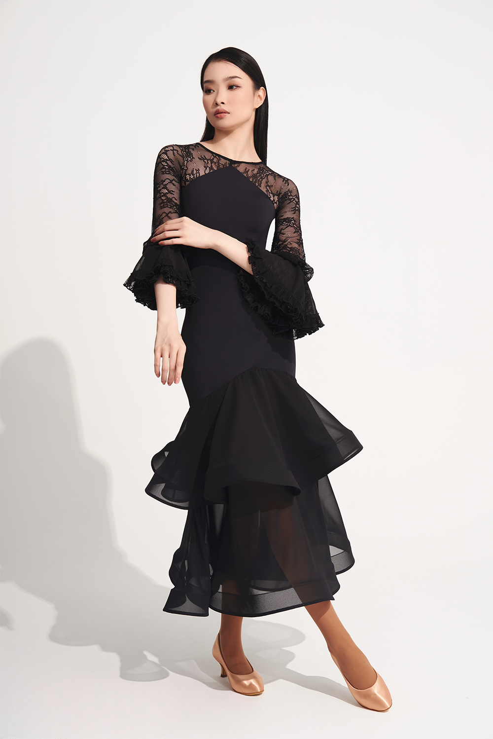 DANCE QUEEN 719 Ruffle Black Lace Sleeve Custom Dress This custom dress features ruffle and lace details that exude confidence and style.&nbsp;