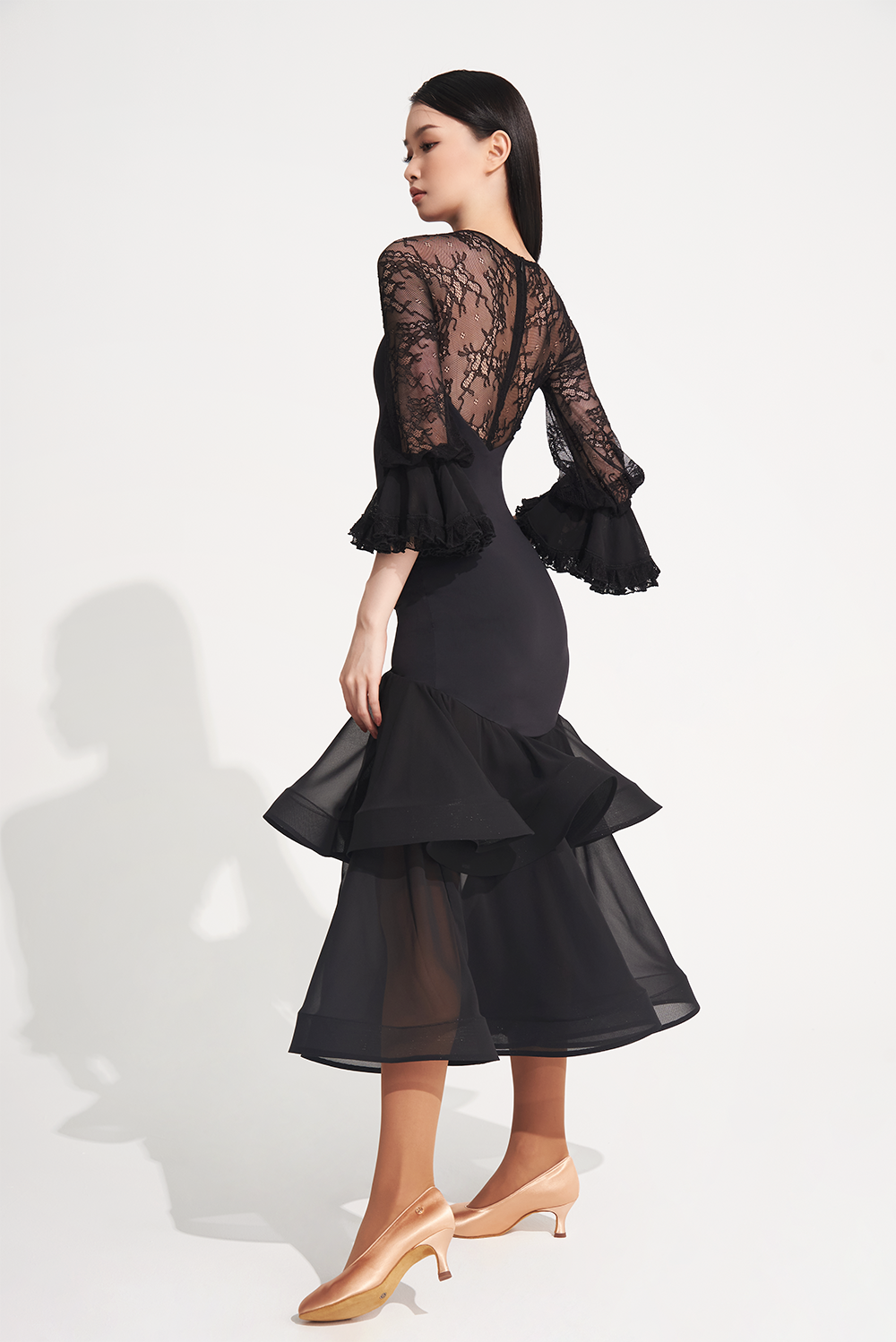 DANCE QUEEN 719 Ruffle Black Lace Sleeve Custom Dress This custom dress features ruffle and lace details that exude confidence and style.&nbsp;