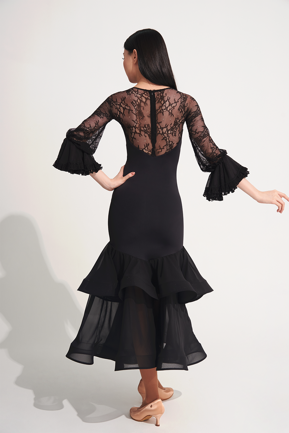 DANCE QUEEN 719 Ruffle Black Lace Sleeve Custom Dress This custom dress features ruffle and lace details that exude confidence and style.&nbsp;