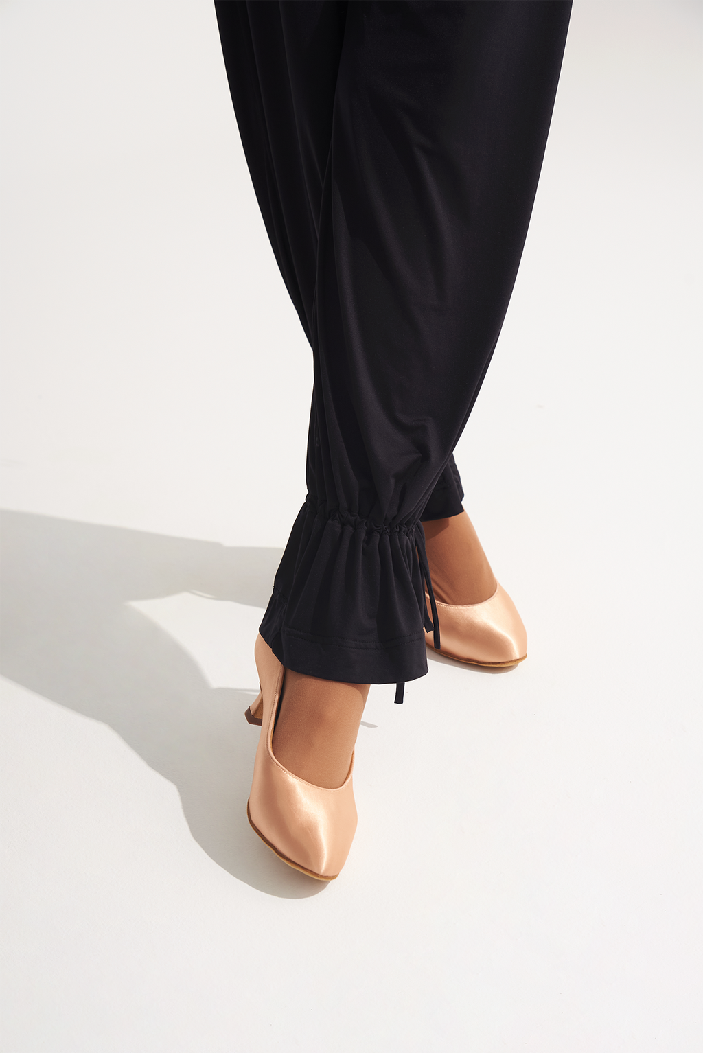 Upgrade your dance training with the DANCE QUEEN 701-9 Trouser! Our elastic waistband offers flexibility and comfort, perfect for long hours of practice. Crafted with a dancer's needs in mind, these trousers will enhance your performance. Take your ballroom training to the next level with style and convenience.