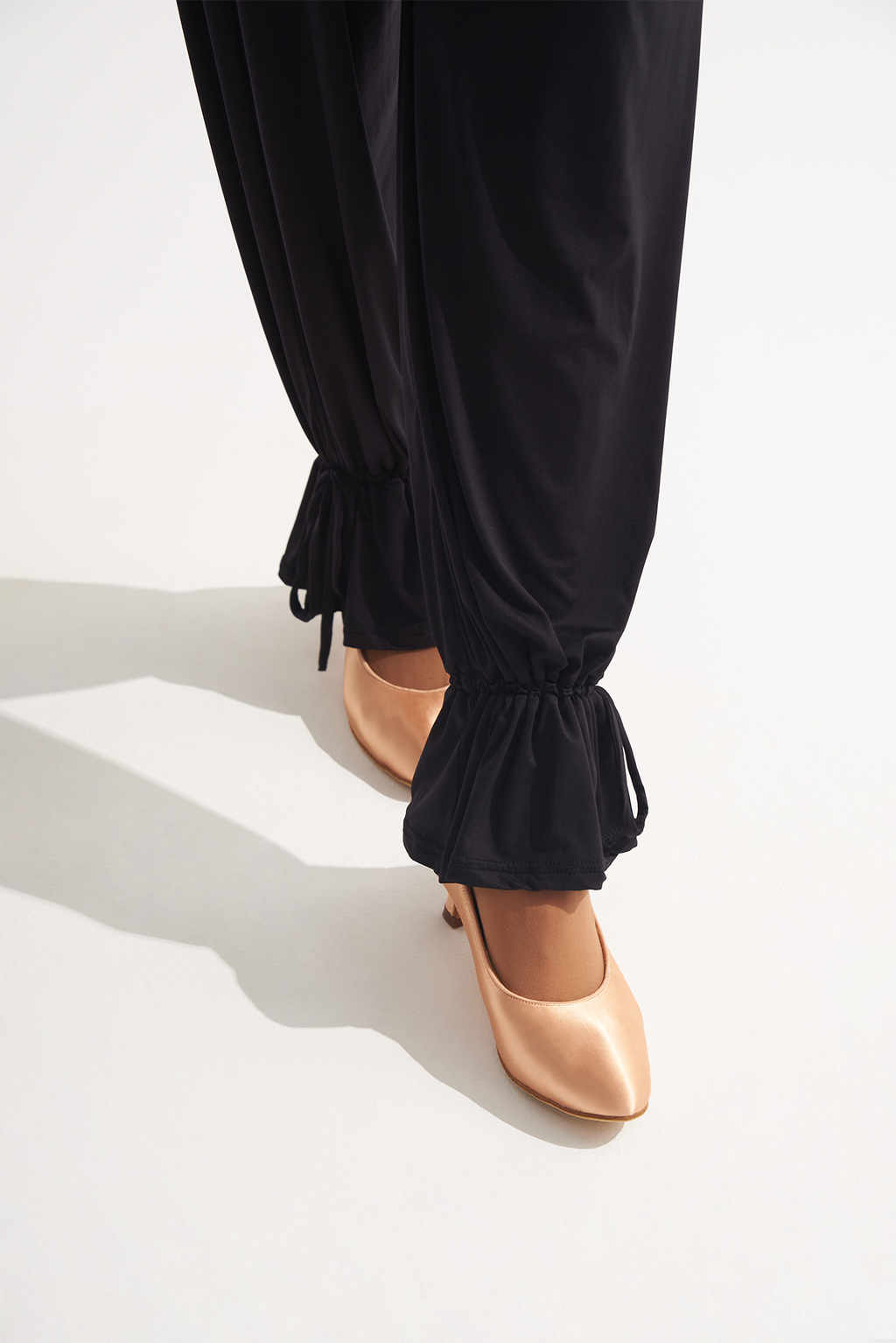 Introducing the upgraded DANCE QUEEN 266-13 ankle strap trouser for ballroom training. Enhance your dance moves with its secure ankle strap and sophisticated design. Train like a queen in style and comfort.