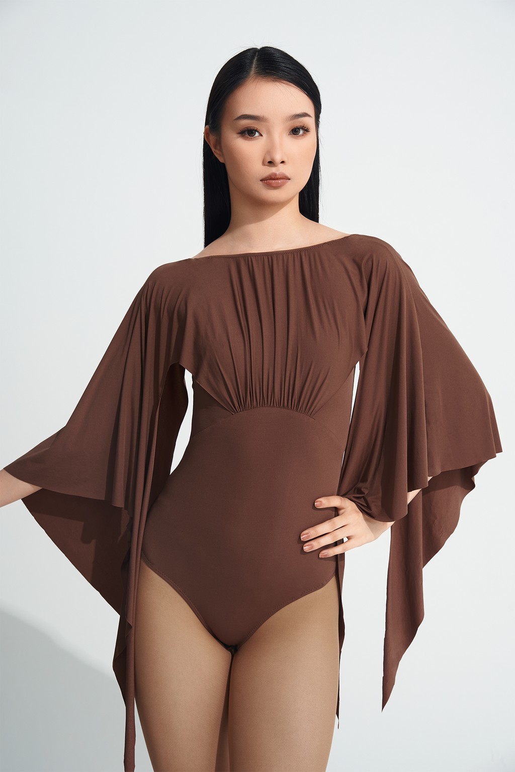 Be the queen of the dance floor with our DANCE QUEEN 723-2 Coffee Ruffle Leotard. This stunning leotard features delicate ruffle details that will gracefully move with you as you perform. Made with high-quality materials, our leotard offers both comfort and style, making you stand out as the true dance queen you are!