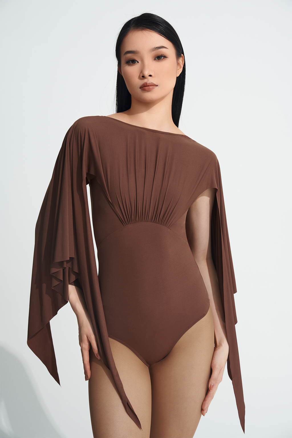 Be the queen of the dance floor with our DANCE QUEEN 723-2 Coffee Ruffle Leotard. This stunning leotard features delicate ruffle details that will gracefully move with you as you perform. Made with high-quality materials, our leotard offers both comfort and style, making you stand out as the true dance queen you are!