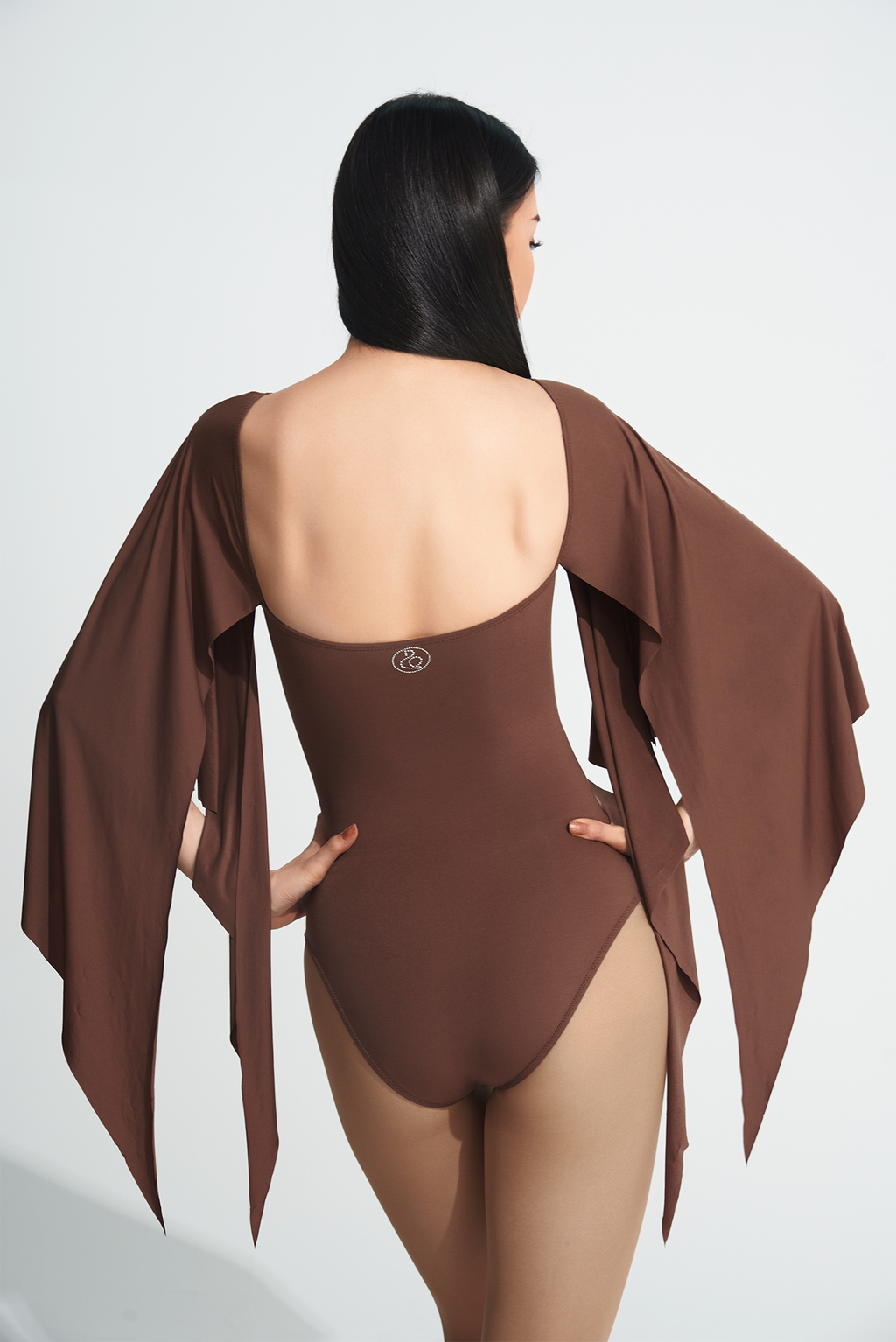 Be the queen of the dance floor with our DANCE QUEEN 723-2 Coffee Ruffle Leotard. This stunning leotard features delicate ruffle details that will gracefully move with you as you perform. Made with high-quality materials, our leotard offers both comfort and style, making you stand out as the true dance queen you are!