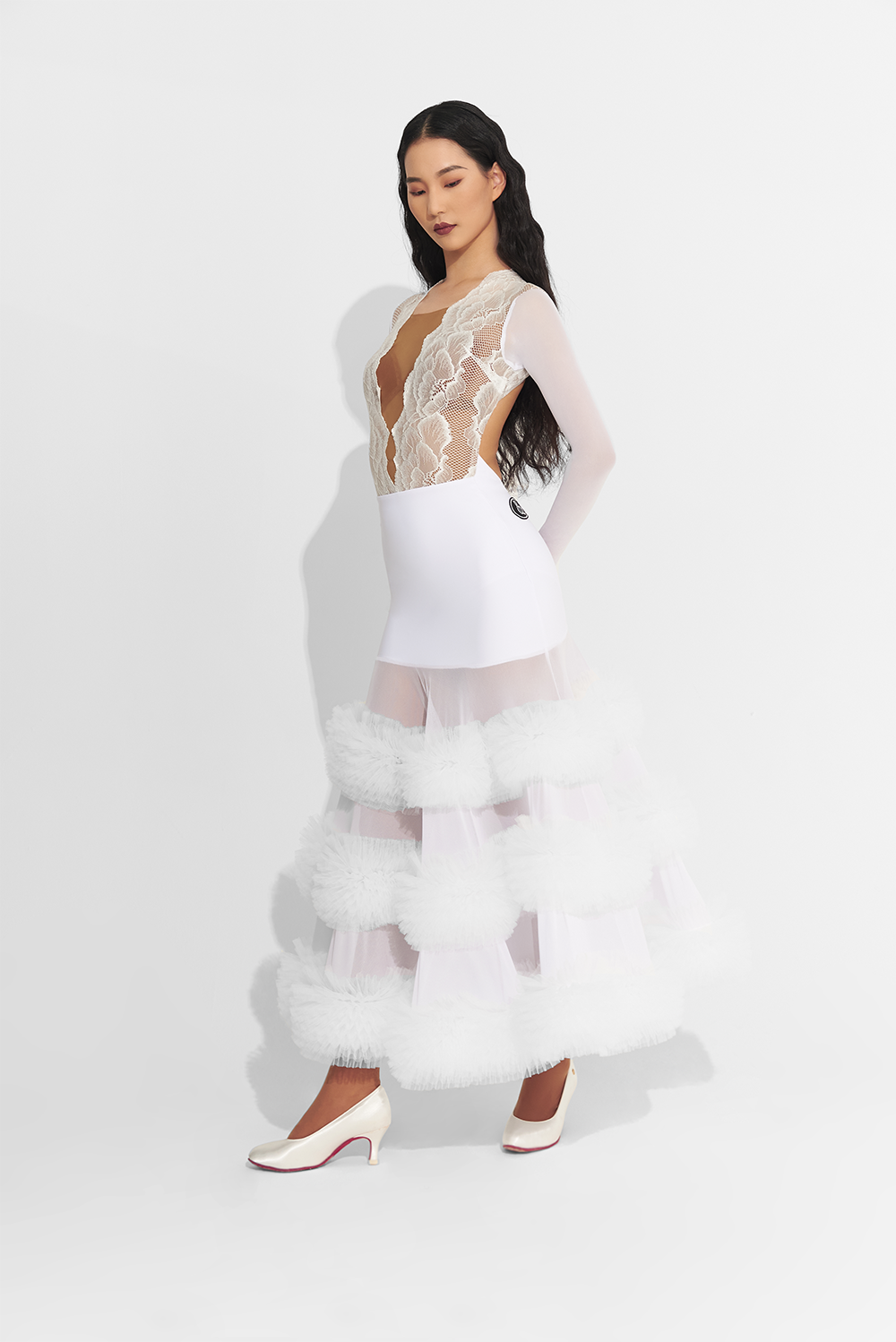 Unleash your inner dance queen in this custom dress featuring a white lace ruffle skirt. Make a statement on the dance floor with this bold and daring design. Perfect for the risk-taker who loves to stand out and shine!