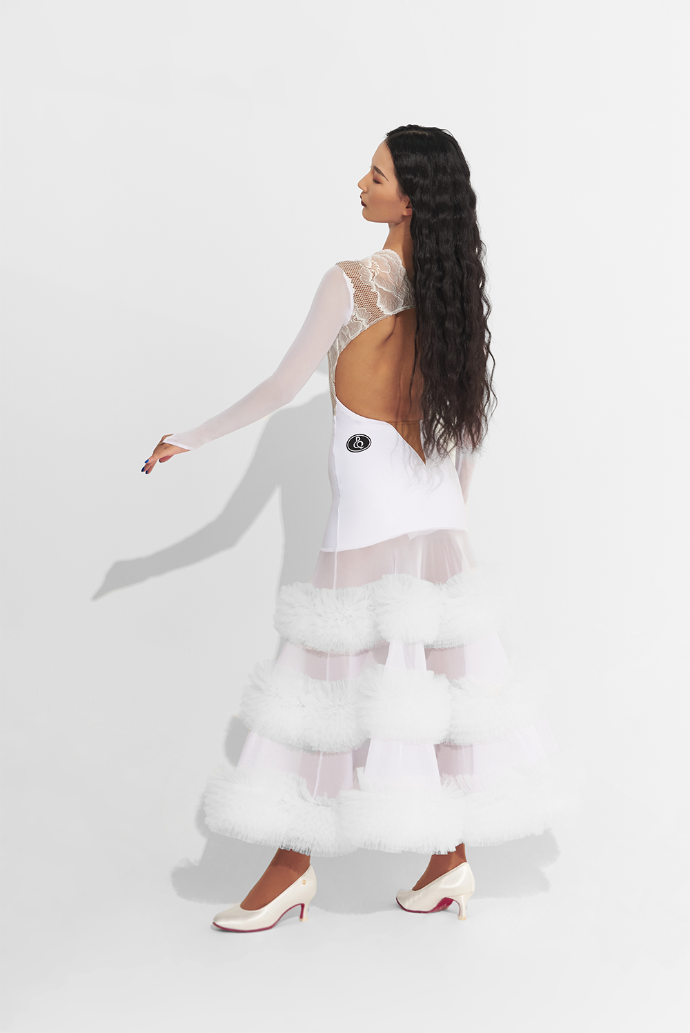 Unleash your inner dance queen in this custom dress featuring a white lace ruffle skirt. Make a statement on the dance floor with this bold and daring design. Perfect for the risk-taker who loves to stand out and shine!