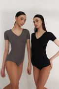 Introducing the DANCE QUEEN V-Neck Short Sleeve Ribbed Leotard, perfect for dancers of all levels. Its ribbed fabric offers a sleek and comfortable fit, while the v-neck design adds a touch of elegance. The short sleeves provide ease of movement, allowing you to dance with confidence and grace.